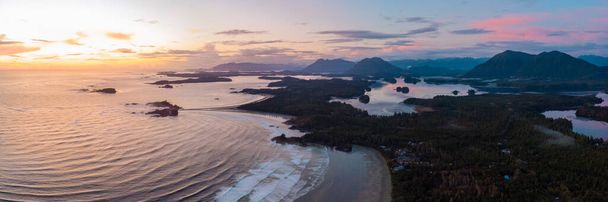 Aerial view over Tofino Pacific Rim national park with a drone from above Cox Bay Vancouver Island Canada. Sunset at long beach Tofino Vancouver Island - Photo, image