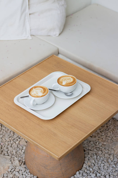 cup of coffee on wooden table - Foto, imagen