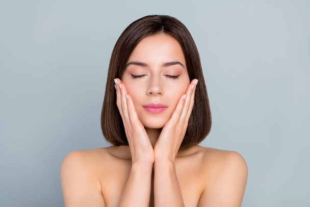 Portrait of aesthetic lady touch hands cheeks enjoy plastic surgery detox procedure ideal skin isolated over grey color background. - 写真・画像