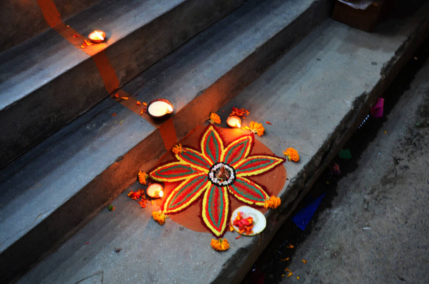 Sacrificial offering and Rangoli powder or sand paint coloured nepalese style for nepali people respect praying rite offer to deity in diwali festival of lights of major celebrated in Kathmandu, Nepal - Fotoğraf, Görsel