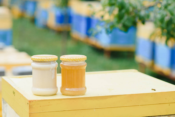 jar of fresh honey in a glass jar. Beekeeping concept. Top view. Copy space - Fotó, kép