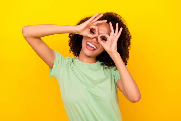 Photo of hooray brunette wavy lady hands eyewear wear green t-shirt isolated on vivid yellow color background. - Fotografie, Obrázek