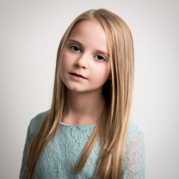 Blue Eyed Young Girl in Turquoise Top Isolated - Photo, Image
