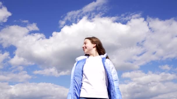 happy tween girl in autumn jacket enjoy the sun on sky background, happiness. - Filmmaterial, Video