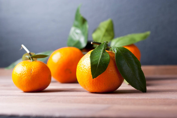 mandarins on wooden table - Фото, зображення