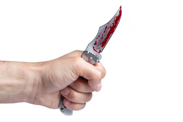 Hand holding a bloody knife, a large bloody knife, bloody theme, a killer with a knife, white background, isolated, violence, suicide, murder, a thug, a butcher - Фото, изображение
