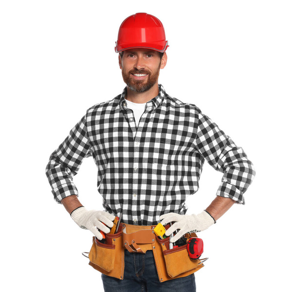 Professional builder in hard hat with tool belt isolated on white - Fotó, kép