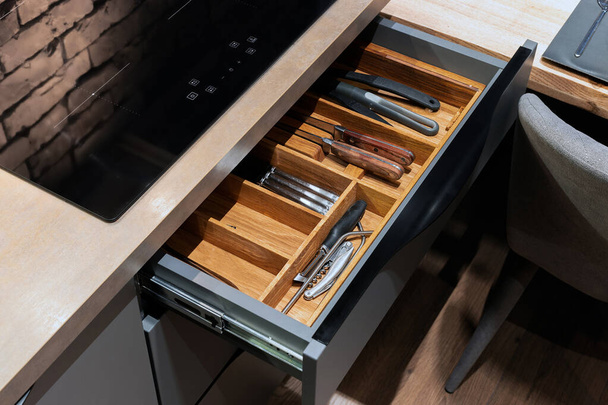 Modern kitchen. Set of cutlery trays in kitchen drawer. Solid oak wood cutlery drawer inserts. - Foto, Bild