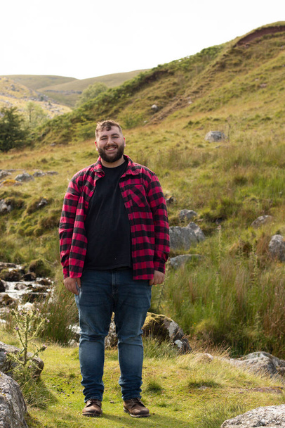 Plus size male with brown hair and a beard on a travel adventure - Foto, Imagem