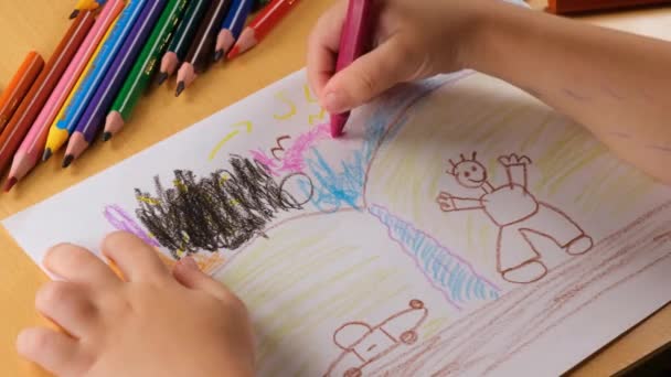 kid painting, preschool age kid painting picture with colorful pens - Filmagem, Vídeo
