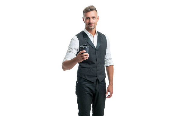 Happy professional man in suit vest holding disposable cup with takeaway coffee isolated on white. - Photo, Image
