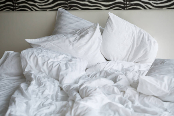 Bed with soft pillows and white sheets. White bed set - Fotó, kép