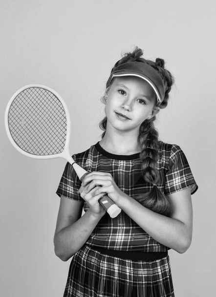 healthy sporty tween girl hold tennis racket, badminton. - Fotó, kép