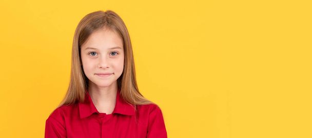 cheerful kid in red shirt. beauty and fashion. female fashion model. pretty look of young girl. Child face, horizontal poster, teenager girl isolated portrait, banner with copy space - Foto, Imagen