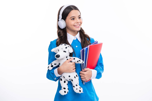 Back to school. Teenager schoolgirl hold toy. School children with favorite toys on isolated white studio background - Foto, Imagen
