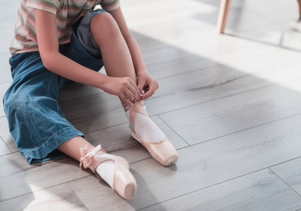 Little girls are getting ready for ballet lessons. High quality photo - Zdjęcie, obraz