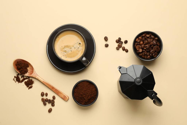 Flat lay composition with ground coffee and roasted beans on beige background - Φωτογραφία, εικόνα