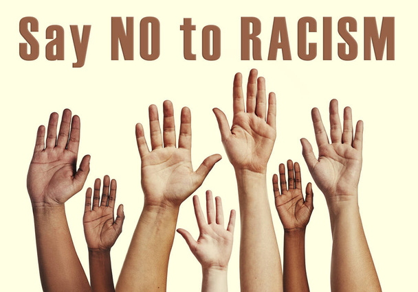 Its never too late to stop the hate. unrecognizable raising their hands with the words say no to racism above them - Fotografie, Obrázek