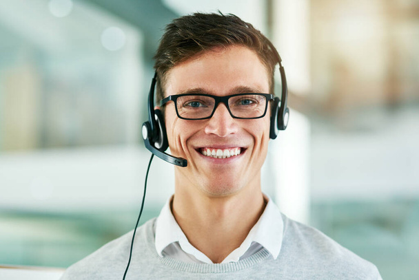 What are you waiting for Call us today. Portrait of a young call center agent working in an office - Photo, Image