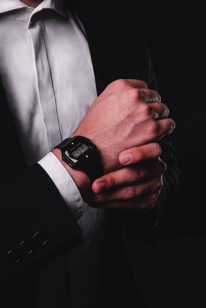 Close up of a mans hands with watch. Man in suit with shirt and black suit. Wrist watch and a businessman. High quality photo - Valokuva, kuva