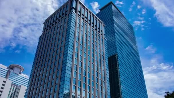 A timelapse of cloud at the building in the business town wide shot zoom. High quality 4k footage. Nakano district Nakanosakaue Tokyo Japan 07.20.2022 Here is a center of the city in Tokyo.  - Filmagem, Vídeo