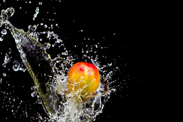 Mango splash over water - Photo, Image