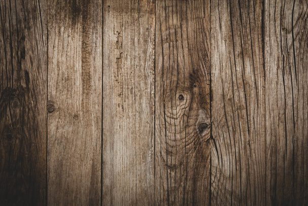 Old wooden table with cracks and scratches, aged rustic background. - Photo, Image