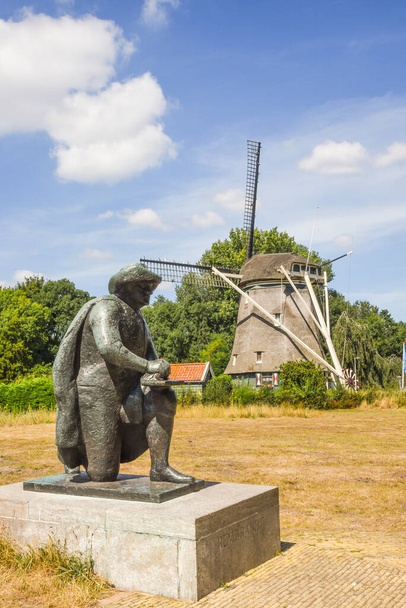 Amsterdam, Netherlands. August 2022. The Riekermolen with a sculpture of the famous dutch painter Rembrandt van Rijn. High quality photo. - Zdjęcie, obraz