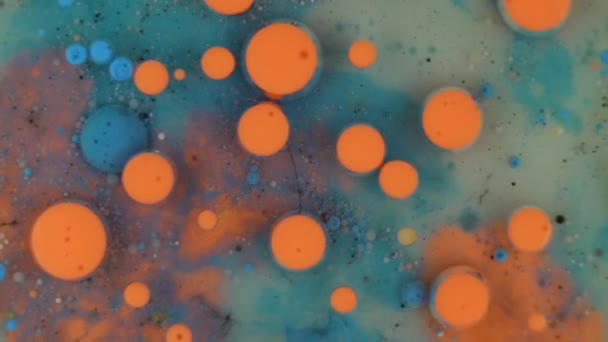 orange and teal ink rotating macro floating background texture science . High quality 4k footage - Metraje, vídeo