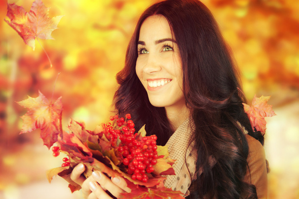 Autumn woman on autumn leafs background. - Photo, Image