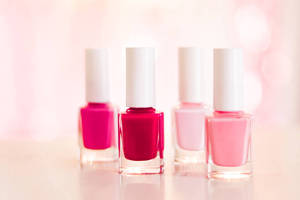 Shades of pink and red nail polish set on glamour background, nailpolish bottles for manicure and pedicure, luxury beauty cosmetics and make-up brand ad - Фото, изображение