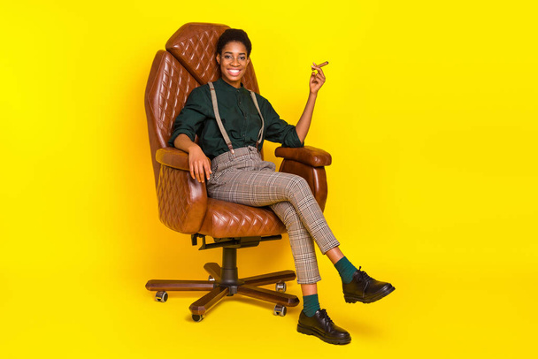 Photo of stylish trendy female male leader sit leather chair smoke cigar wear unisex shirt isolated bright color background. - Φωτογραφία, εικόνα
