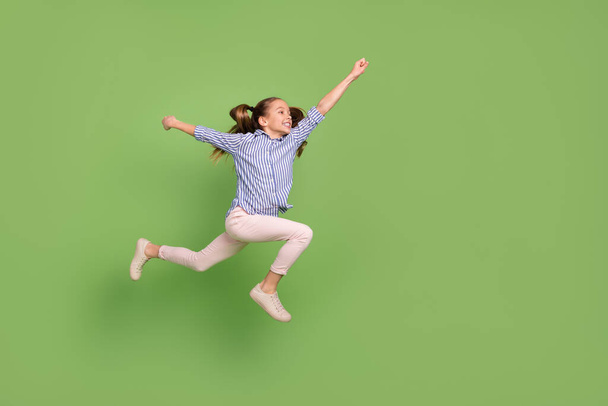 Profile side photo of carefree active child girl jump run fast rush save hero world isolated shine color background. - Photo, Image