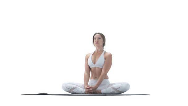 Young athletic attractive woman practicing yoga isolated on whit - Foto, imagen