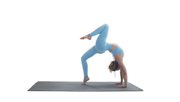 Young athletic attractive woman practicing yoga isolated on whit - Foto, Imagem