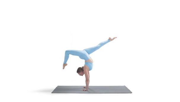 Young athletic attractive woman practicing yoga isolated on whit - Photo, Image
