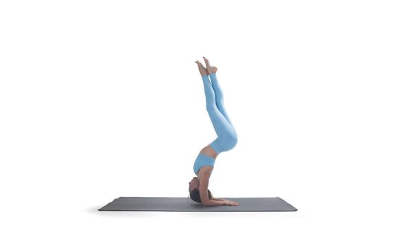 Young athletic attractive woman practicing yoga isolated on whit - Foto, immagini