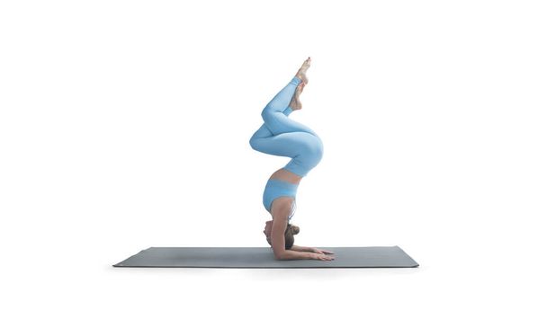 Young athletic attractive woman practicing yoga isolated on whit - Foto, Imagem