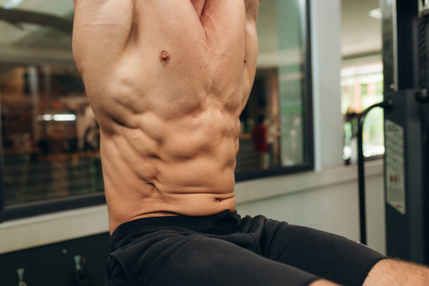 Close up on perfect abs. Strong bodybuilder - Photo, Image