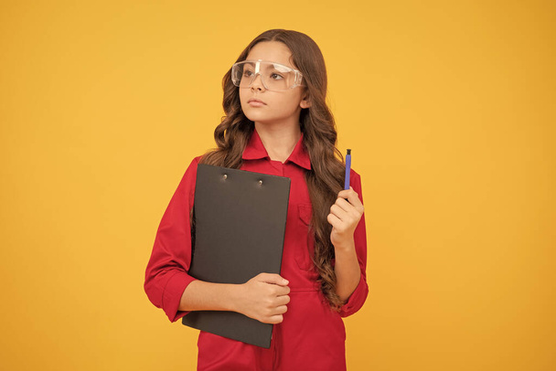 busy worker. kid make notes in folder. improve your poor eyesight. having bad vision. study at school. sight check. teen girl in protective glasses. child wear eyeglasses. concentrated on work. - Photo, Image