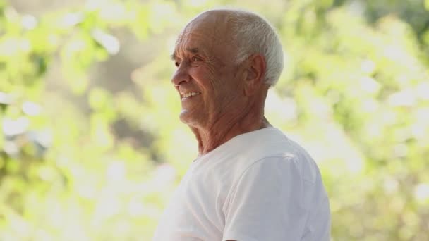 senior man doing sports or exercises outdoors - Video, Çekim