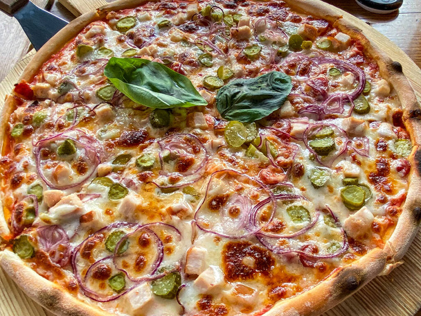 Restaurant Menu - Delicious Fresh Pizza. Pizza on Rustic Wooden Table with Ingredients. Tasty italian pizza. - Valokuva, kuva