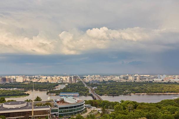 Skyline of Kyiv with Metro bridge and rainbow in the sky. Ukraine - Photo, image