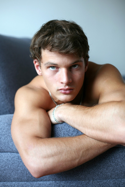 Sexy Young Man on the Sofa - Foto, Bild