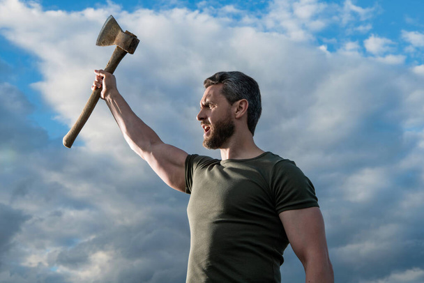 confident man with axe. strong caucasian man hold ax. brutal man on sky background. - Zdjęcie, obraz