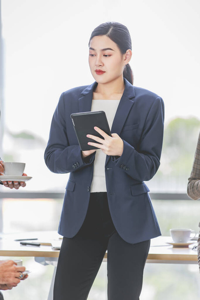 Closeup shot of Asian pretty happy cheerful  female businesswoman intern trainee in casual suit standing smiling in company office - Foto, Bild