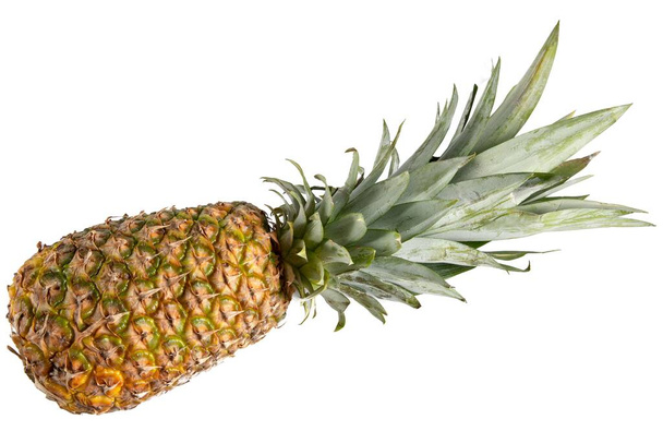 A closeup shot of a fresh pineapple isolated on a white background - Zdjęcie, obraz
