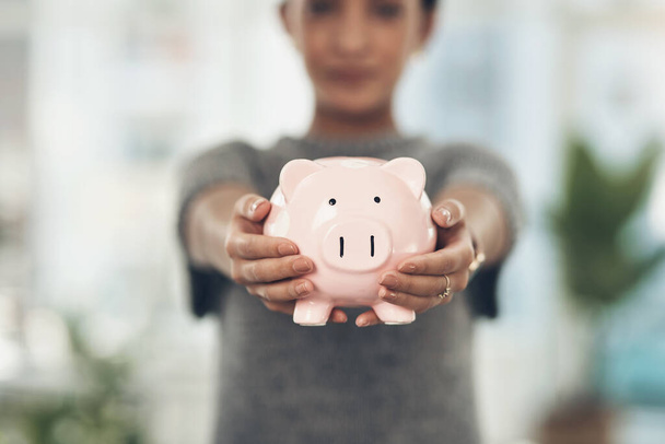 Piggybank, finance and money in the hands of a woman with a mindset on the future for saving, investment and wealth. Closeup of a coin bank in hand, showing financial growth, planning and budget. - Foto, Imagem