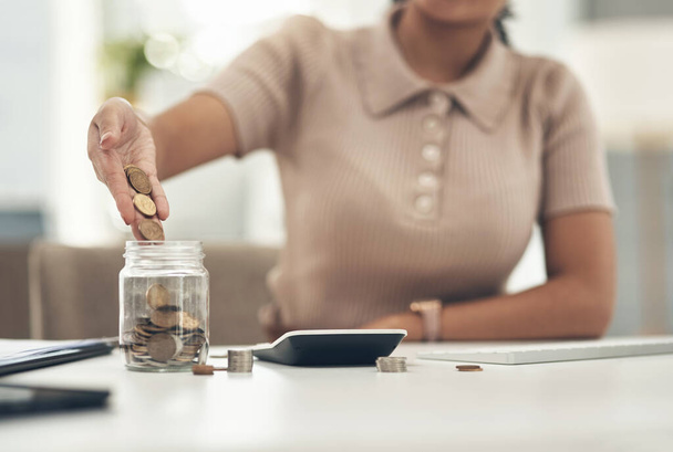 Finance, planning and saving jar for investment or micro loan. Closeup of Accountant, businesswoman or bank advisor sitting at desk. Financial growth for future plans or career change - Photo, image