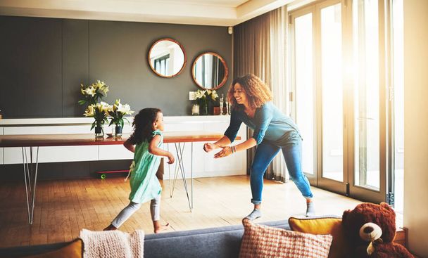 Im the first one she runs to. a young mother and her daughter spending quality time together at home - 写真・画像